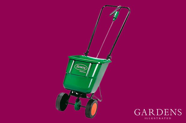 Scotts EvenGreen Drop spreader on a pink background