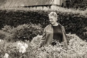 Black and white portrait of Claire Austin in a garden Black and white portrait of Claire Austin in a garden