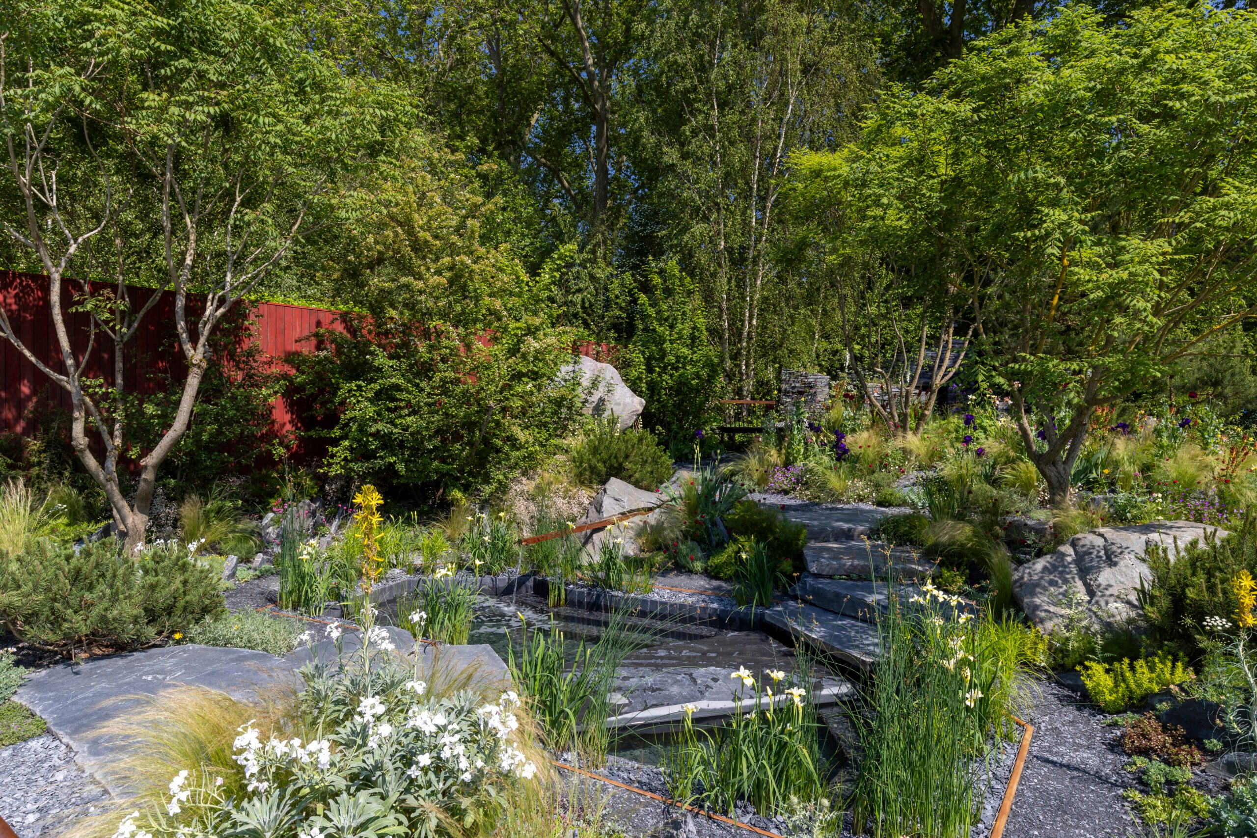 Terrence Higgins Trust Bridge to 2030 Garden at RHS Chelsea Flower Show 2024. Designed by Matthew Childs. Sponsored by Project Giving Back