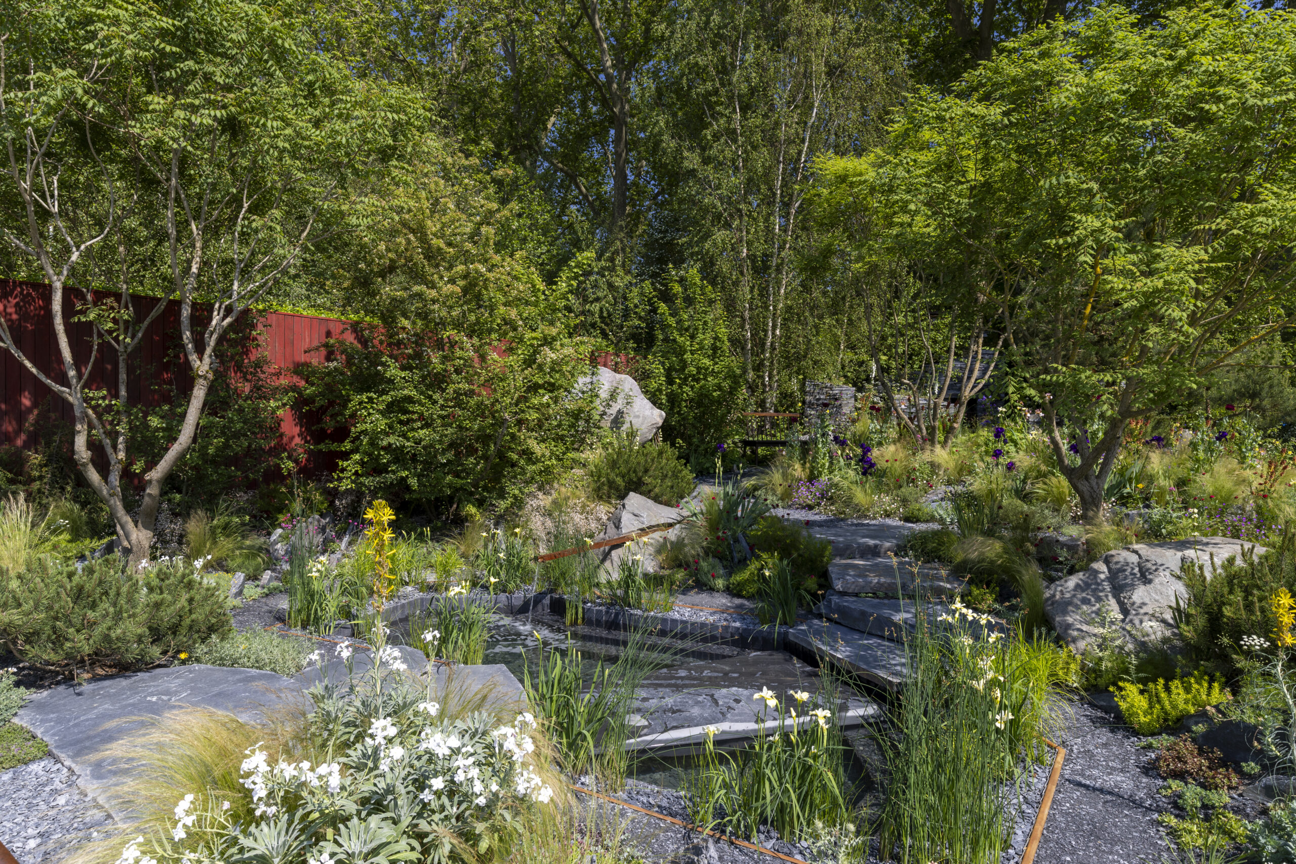Terrence Higgins Trust Bridge to 2030 Garden at RHS Chelsea Flower Show 2024. Designed by Matthew Childs. Sponsored by Project Giving Back