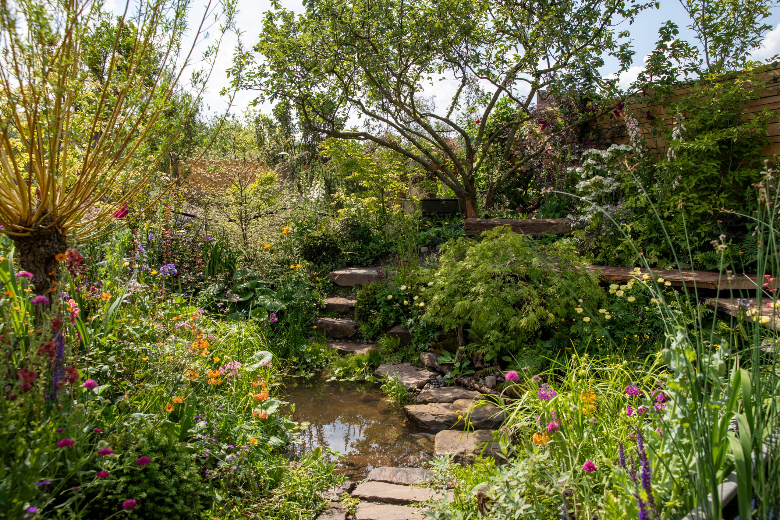 Flood Re: The Flood Resilient Garden at RHS Chelsea Flower Show 2024. Designed by Naomi Slade and Dr Ed Barsley. Sponsored by FloodRe.