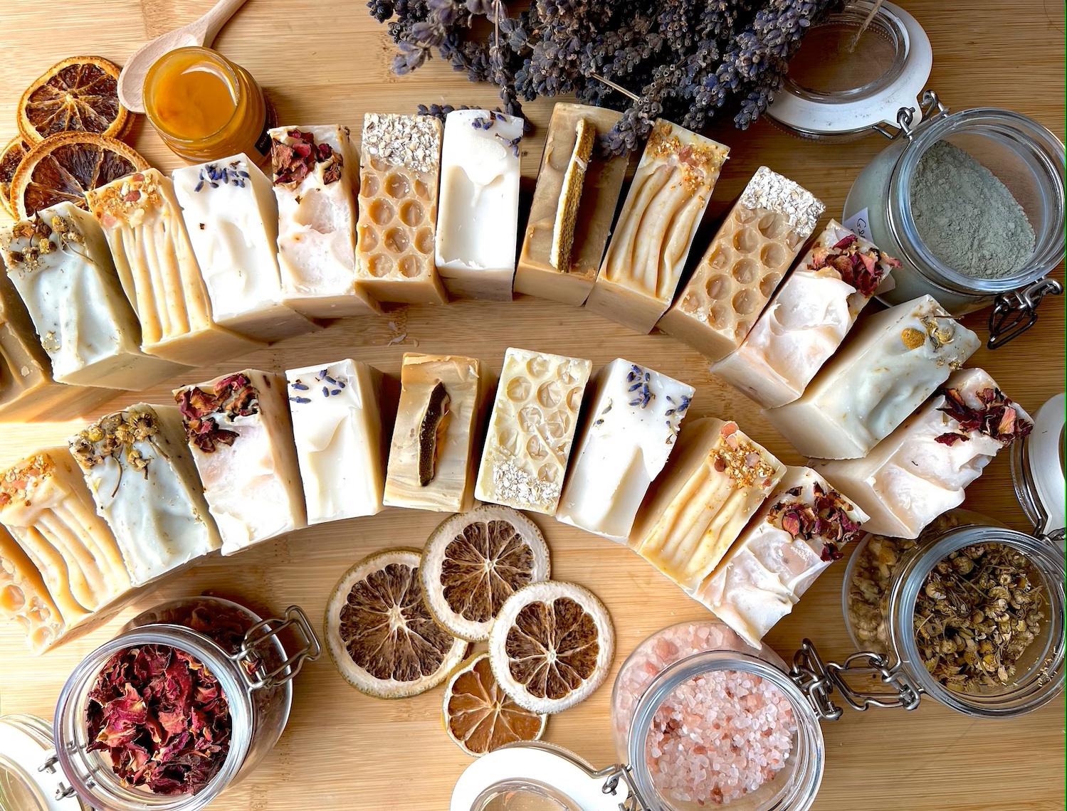 Handmade soap bars with botanical ingredients on a table