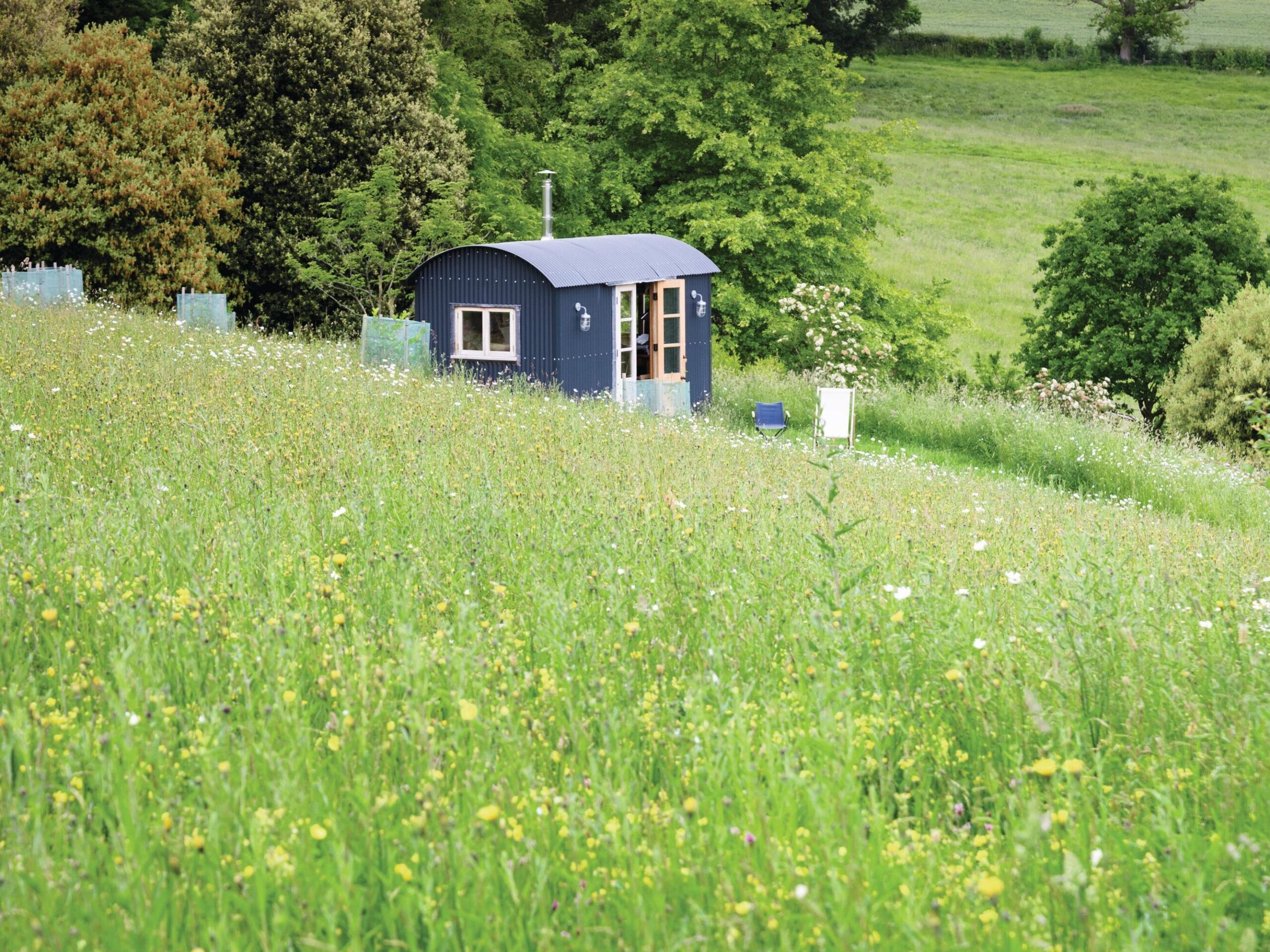 Rediscovered as a shell in nearby Capler Wood, this shepherd’s hut was lovingly restored during lockdown. Sited for views towards the lake, it acts as a romantic getaway and Peter’s home office.