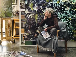 Painter Helen Thomas Painter Helen Thomas sat infront of an artwork