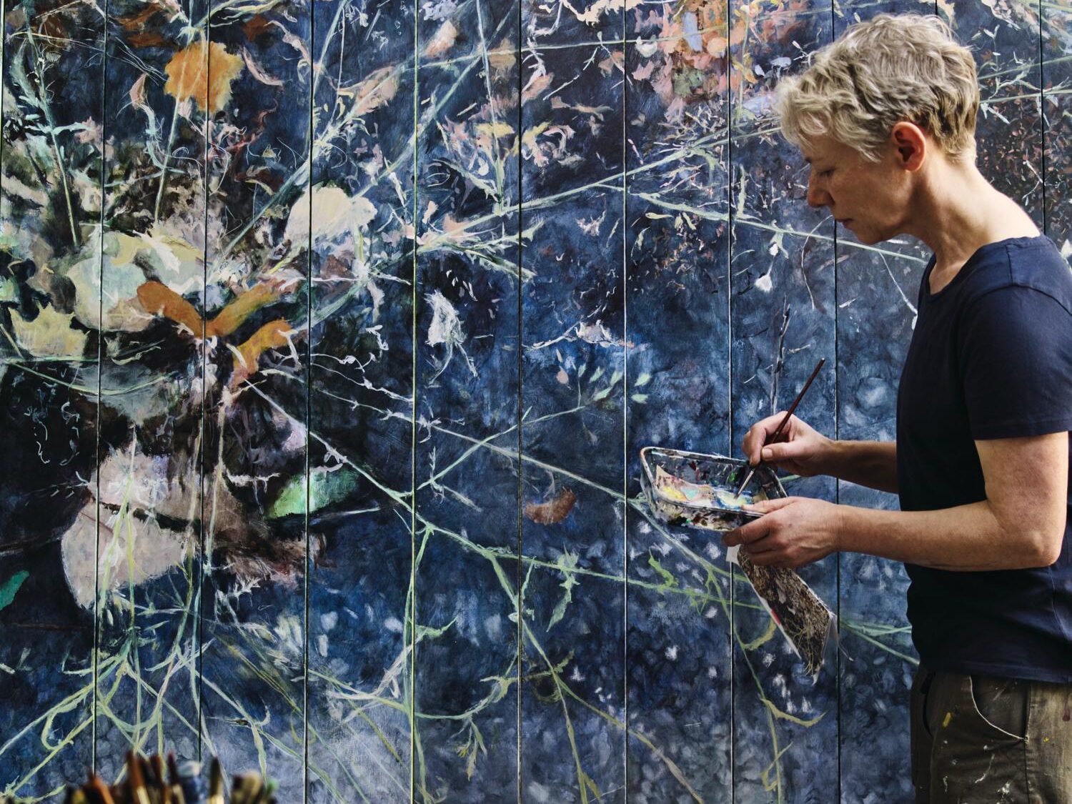 Helen Thomas painting a blue painting