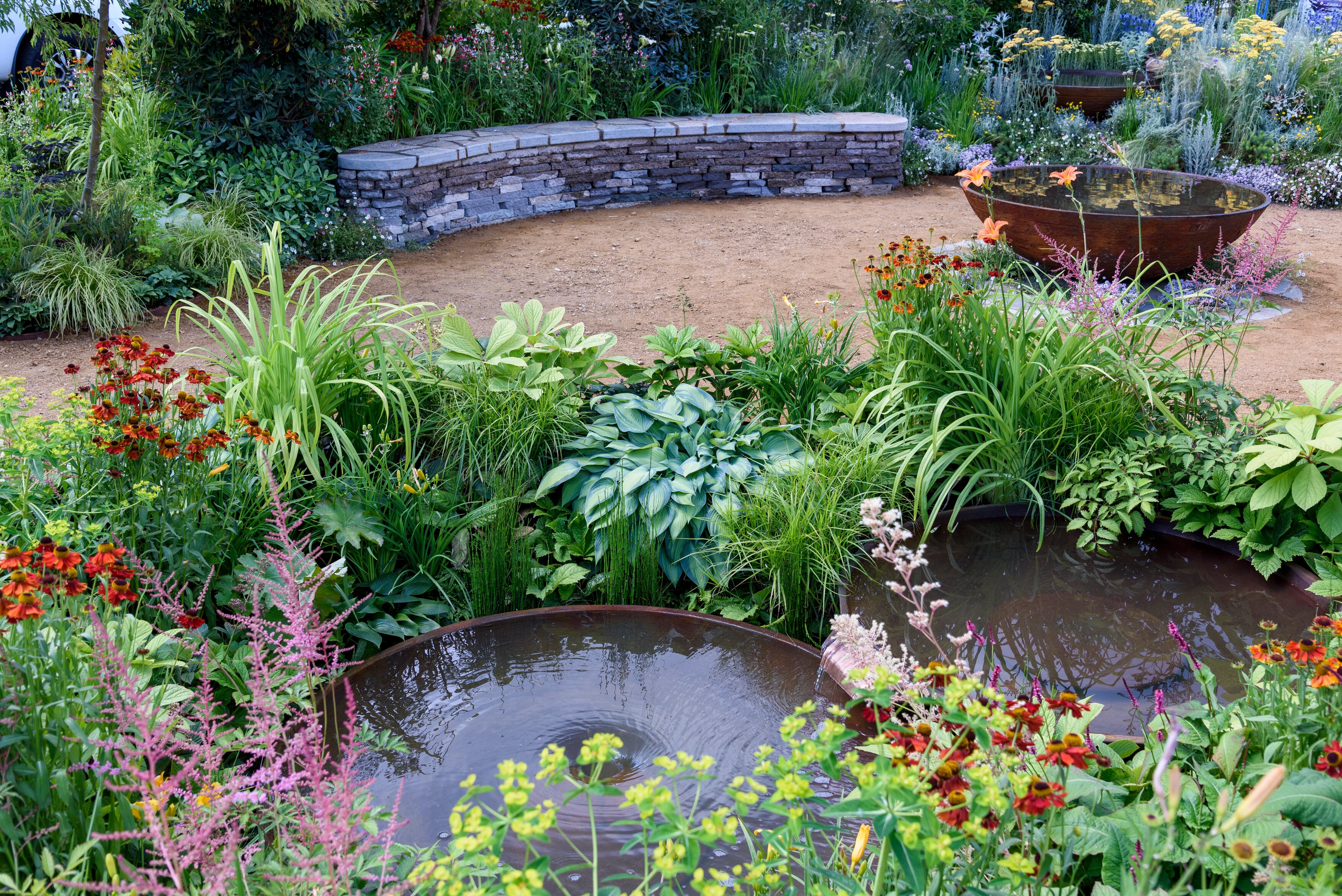 The Mail and RHS Planet Friendly Garden. Designed by Mark Gregory at RHS Hampton Court Palace Garden The Mail and RHS Planet Friendly Garden. Designed by Mark Gregory at RHS Hampton Court Palace Garden