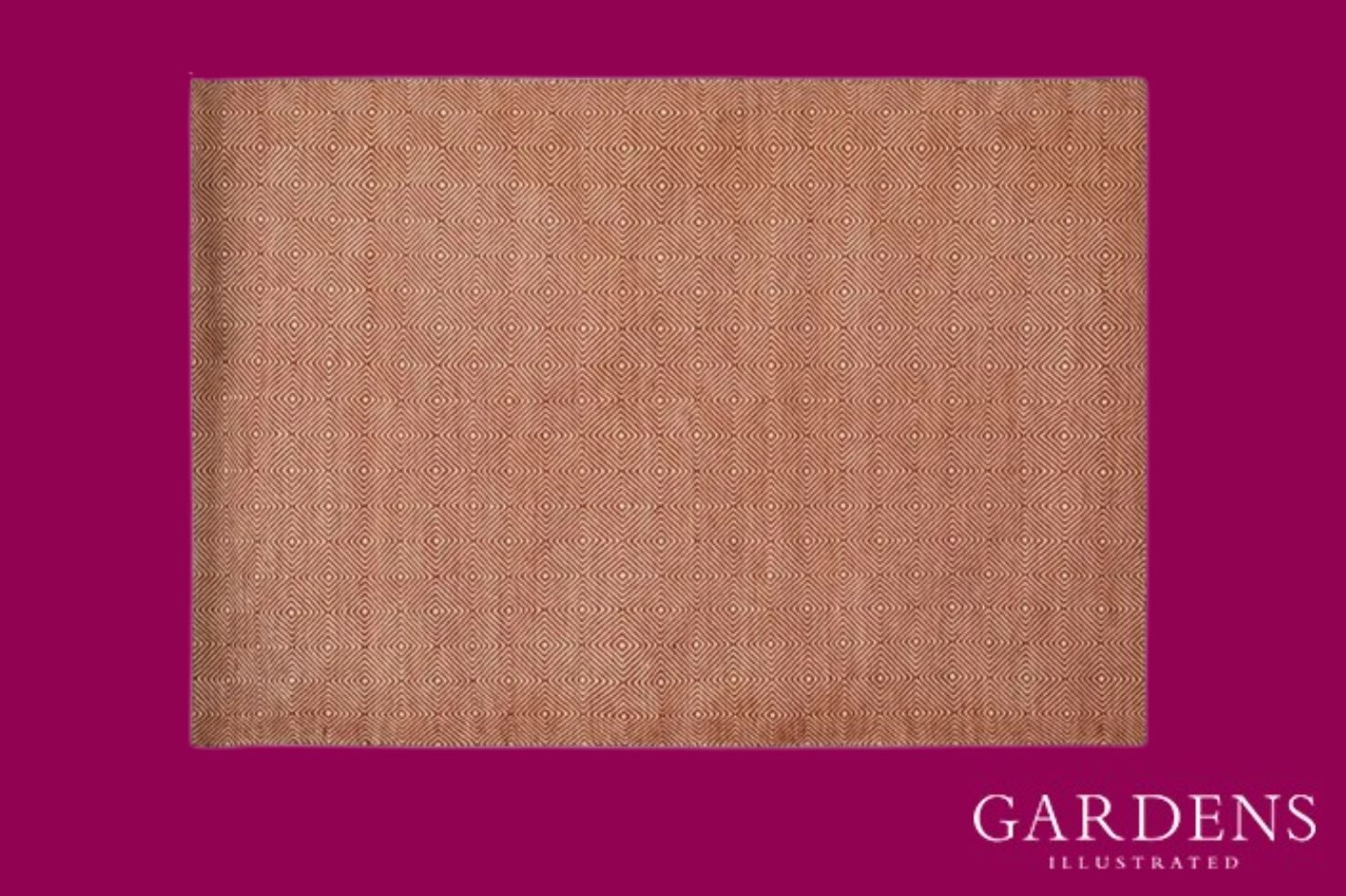 Romilly Terracotta Recycled Rug on a pink background