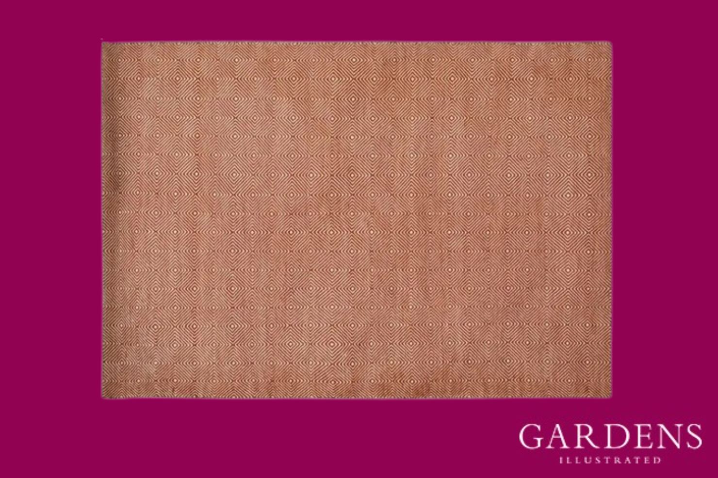 Romilly Terracotta Recycled Rug on a pink background