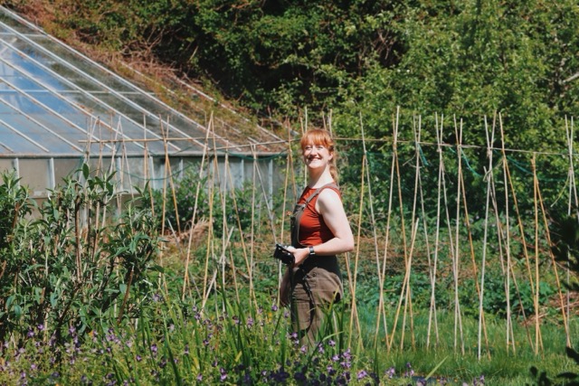 Roisin Taylor of Verde Flower Co. in Northumberland standing in the garden