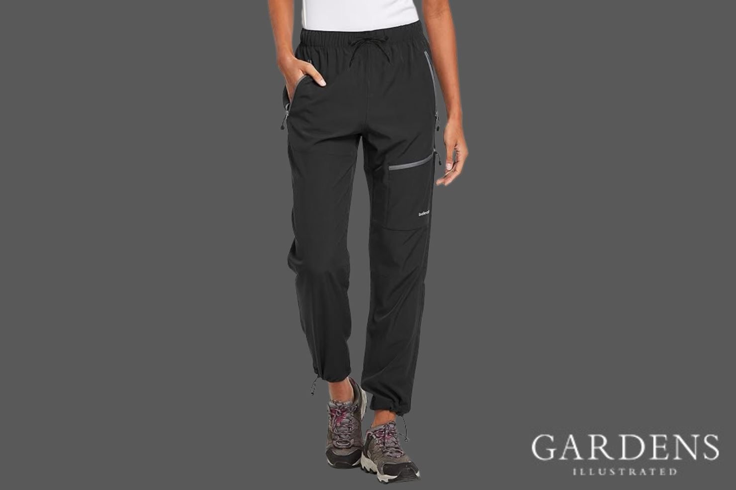 Person wearing BALEAF Waterproof Trousers on a grey background
