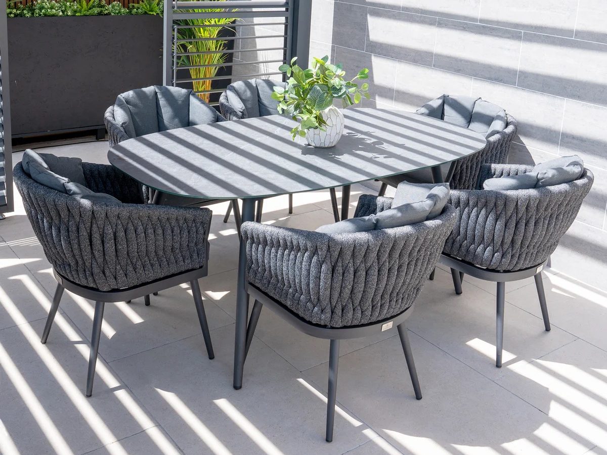 Palma 6 Seat Rope Oval Dining Set with Ceramic Table in Grey on a shady terrace