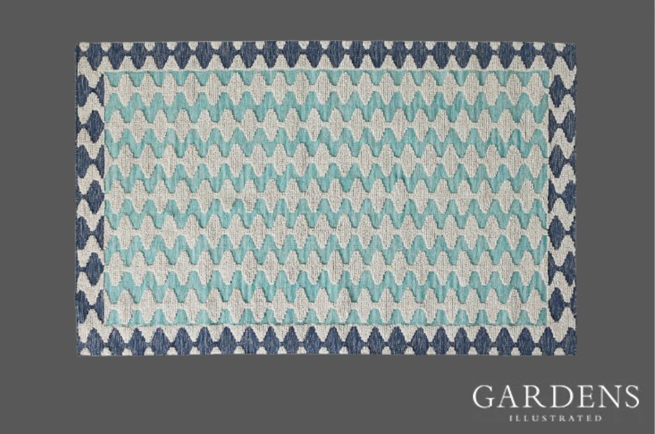 Handwoven Akna Indoor/Outdoor Rug on a grey background