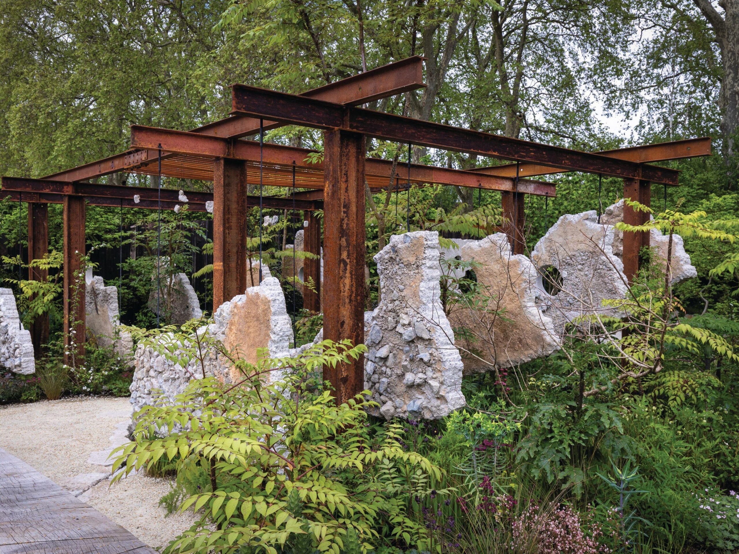 Garden with ferns and sculpture