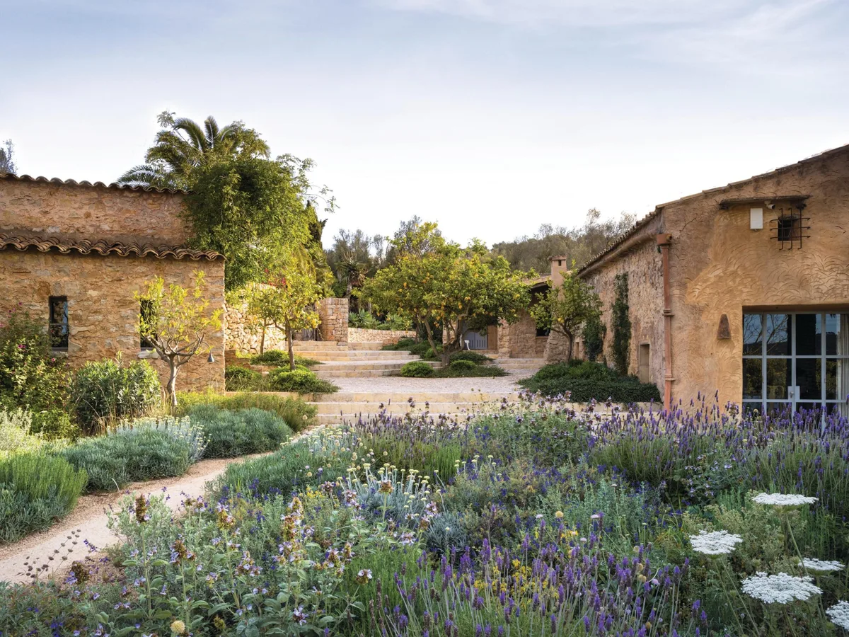 North Mallorcan garden designed by Tom Stuart-Smith Mediterranean garden and buildings in summer
