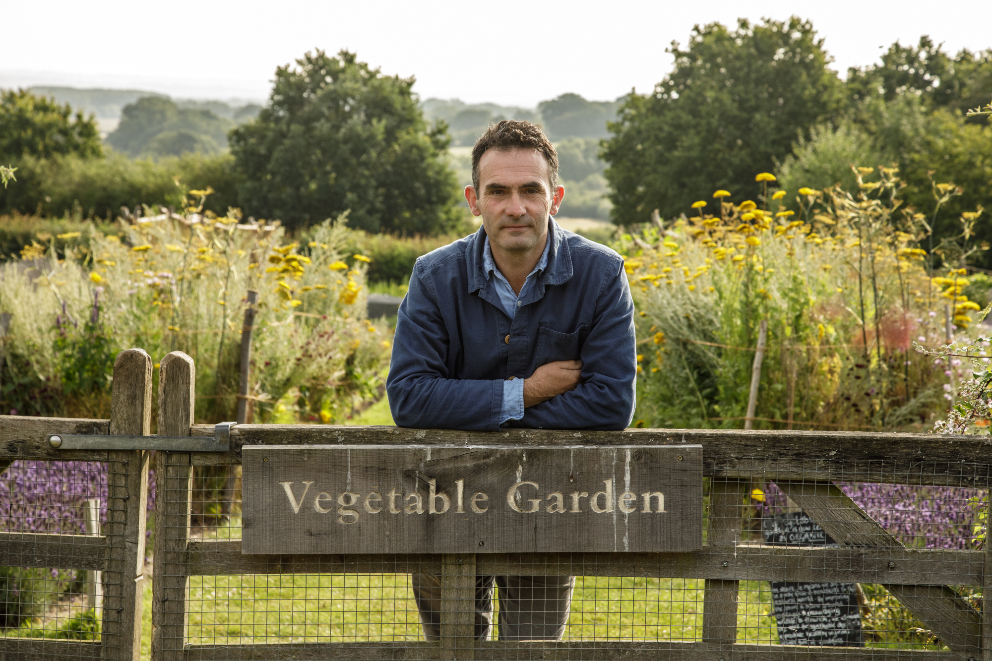 Gardener in the vegetable garden at Sissinghurst