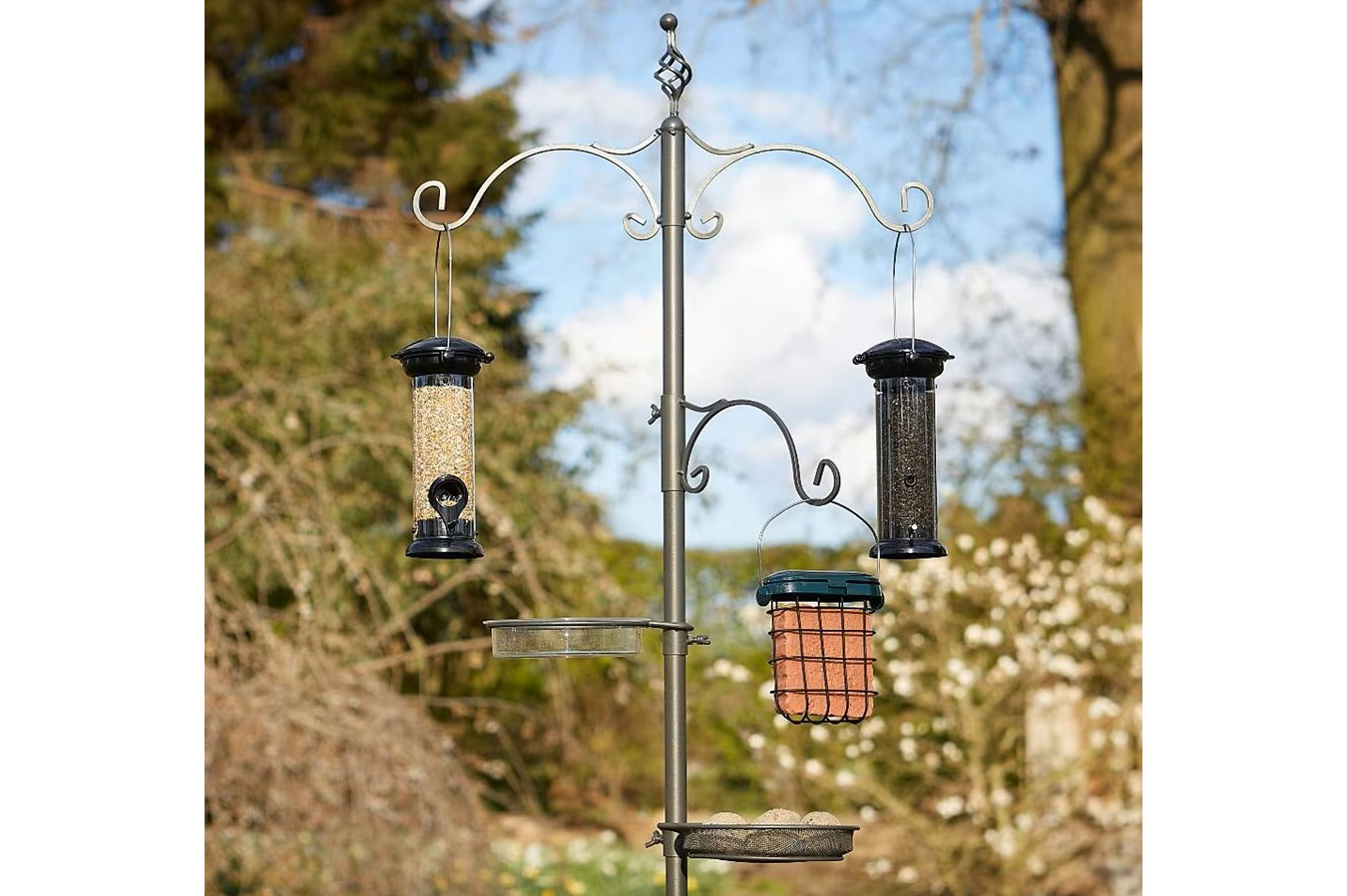 Pewter bird station in a garden