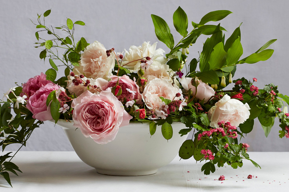 A floral bouquet in a bowl