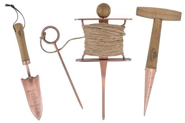 Fallen Fruits copper plated gardening tools on a white background