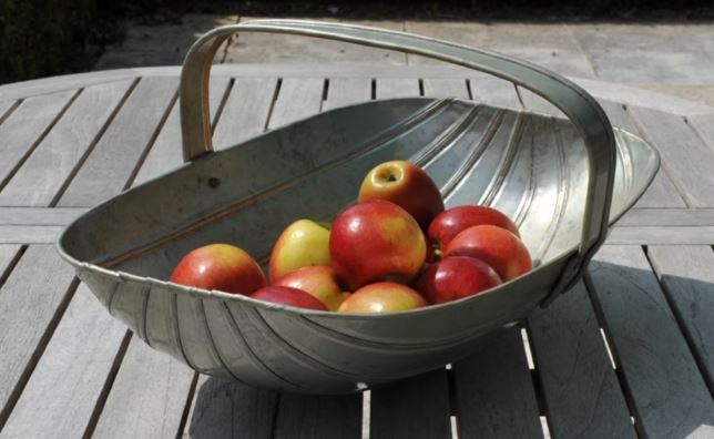 Kitchen garden trug with apples on a table