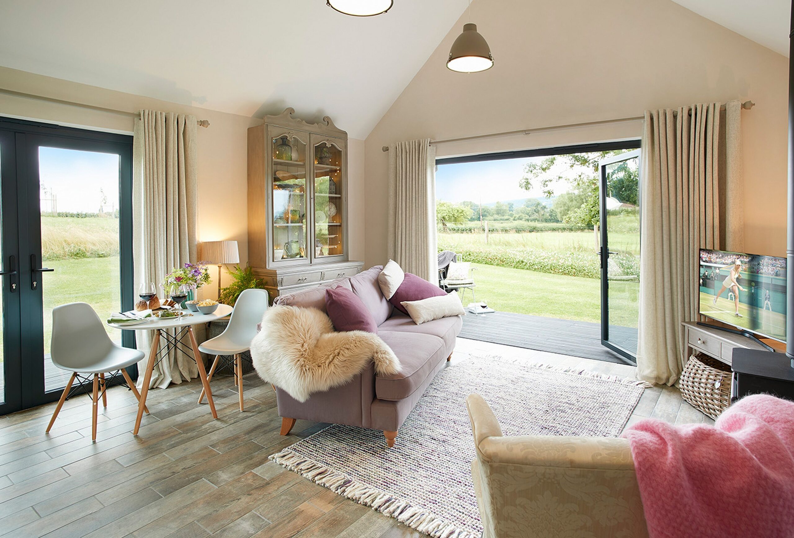 Living room looking out onto garden at Broomers Barn
