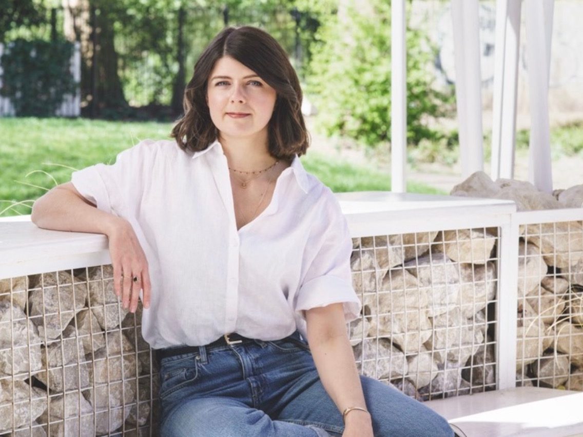 Woman sat in garden room