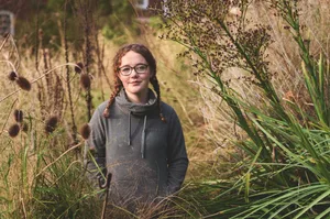Screenshot Woman stood in garden