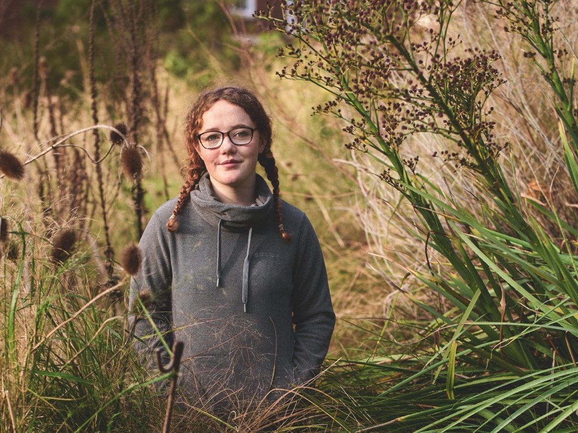 Woman stood in garden