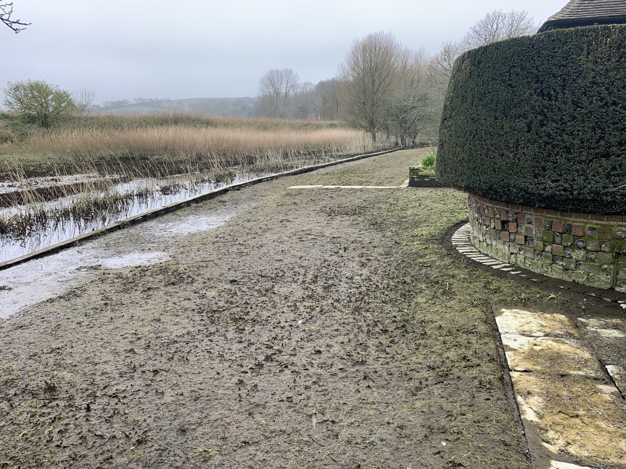 Restricted access and waterlogging in parts of the garden at Alfriston Clergy House in East Sussex