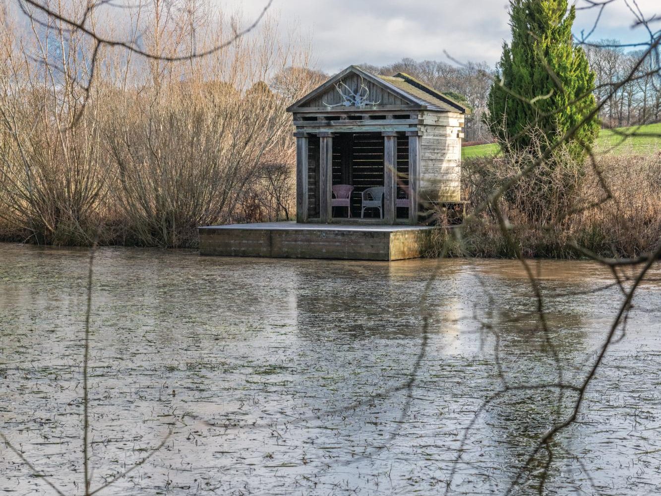 Wooden Hut overlooking pond