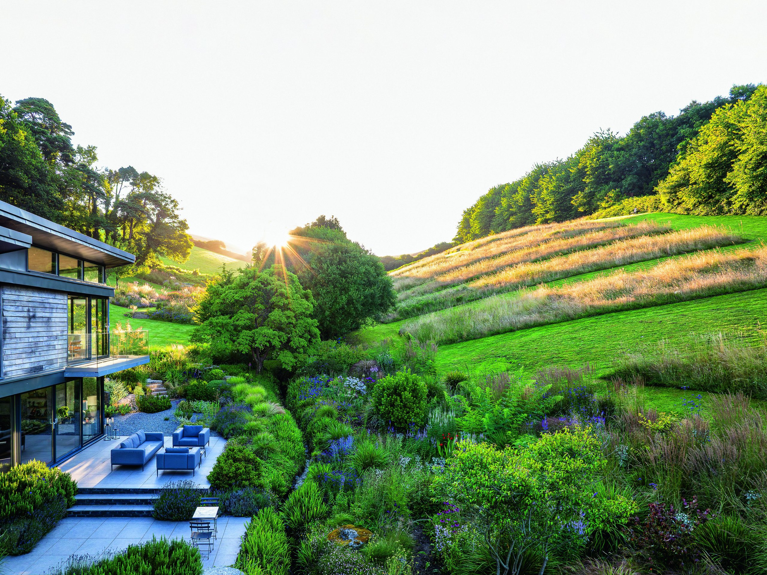 House and garden surrounded by fields