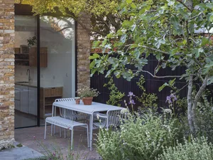Tucked away on one side of the terrace outside the kitchen, the dining area is screened by a fig tree underplanted with trouble-free Mediterranean species, including woolly thyme, Salvia argentea, Ballota pseudodictamnus and pale-lavender irises. Tucked away on one side of the terrace outside the kitchen, the dining area is screened by a fig tree underplanted with trouble-free Mediterranean species, including woolly thyme, Salvia argentea, Ballota pseudodictamnus and pale-lavender irises.
