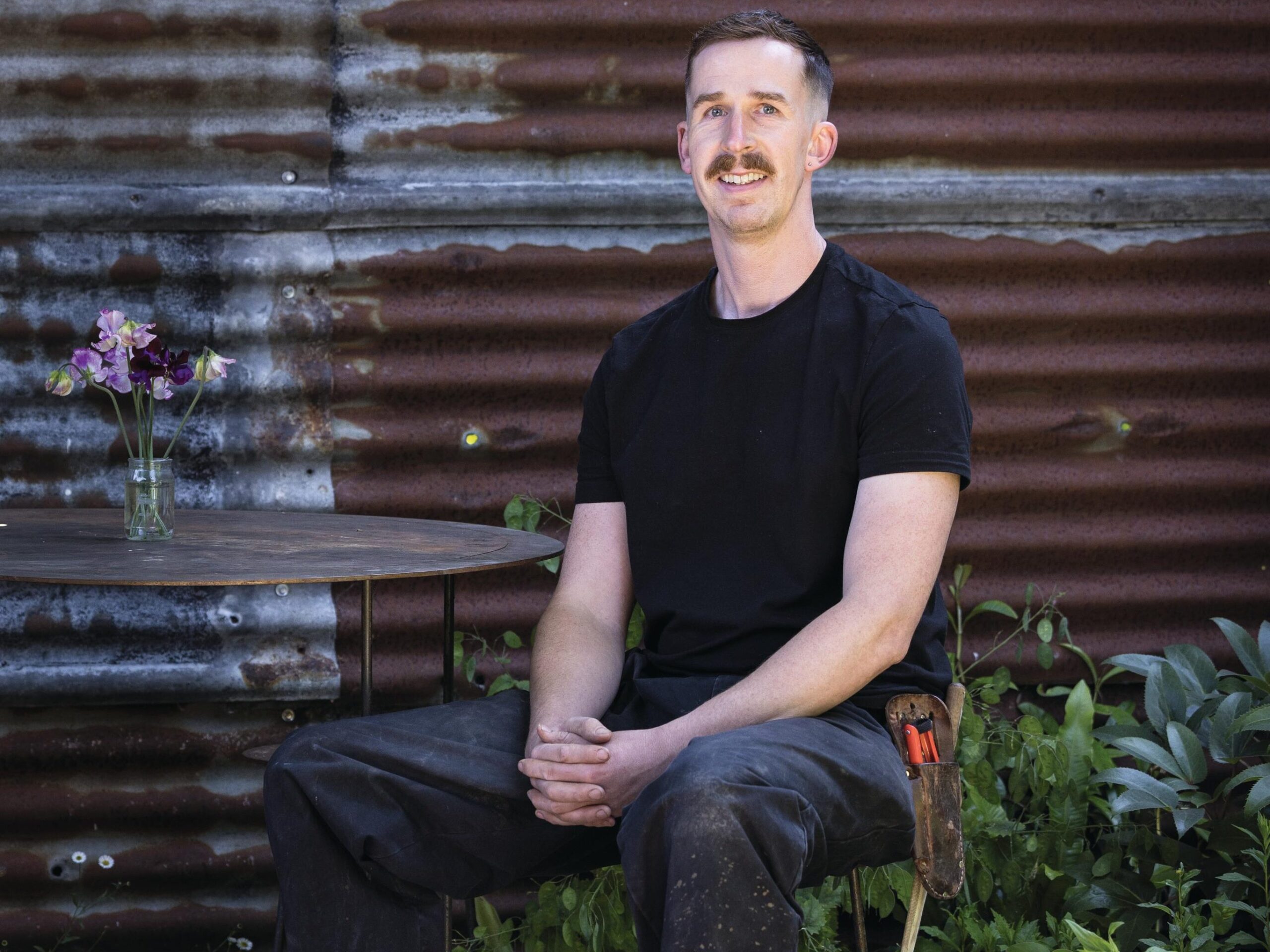Man sat in garden
