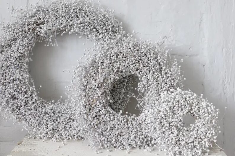 Dried linum wreaths on a shelf