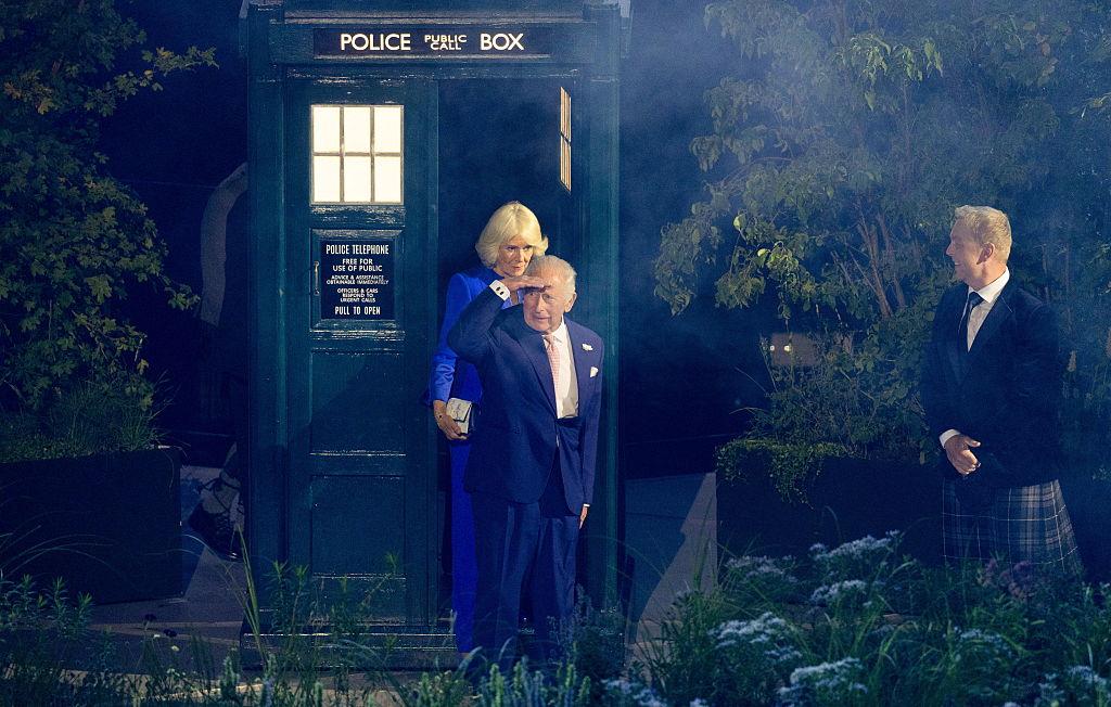 King Charles III and Queen Camilla emerge from the TARDIS during the 2026 Commonwealth Games Opening Ceremony at the OVO Hydro, on July 23, 2026, in Glasgow, Scotland. © Ross MacDonald/SNS Group via Getty Images