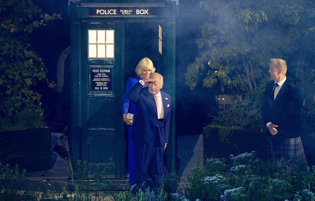 King Charles III and Queen Camilla emerge from the TARDIS during the 2026 Commonwealth Games Opening Ceremony at the OVO Hydro, on July 23, 2026, in Glasgow, Scotland. © Ross MacDonald/SNS Group via Getty Images