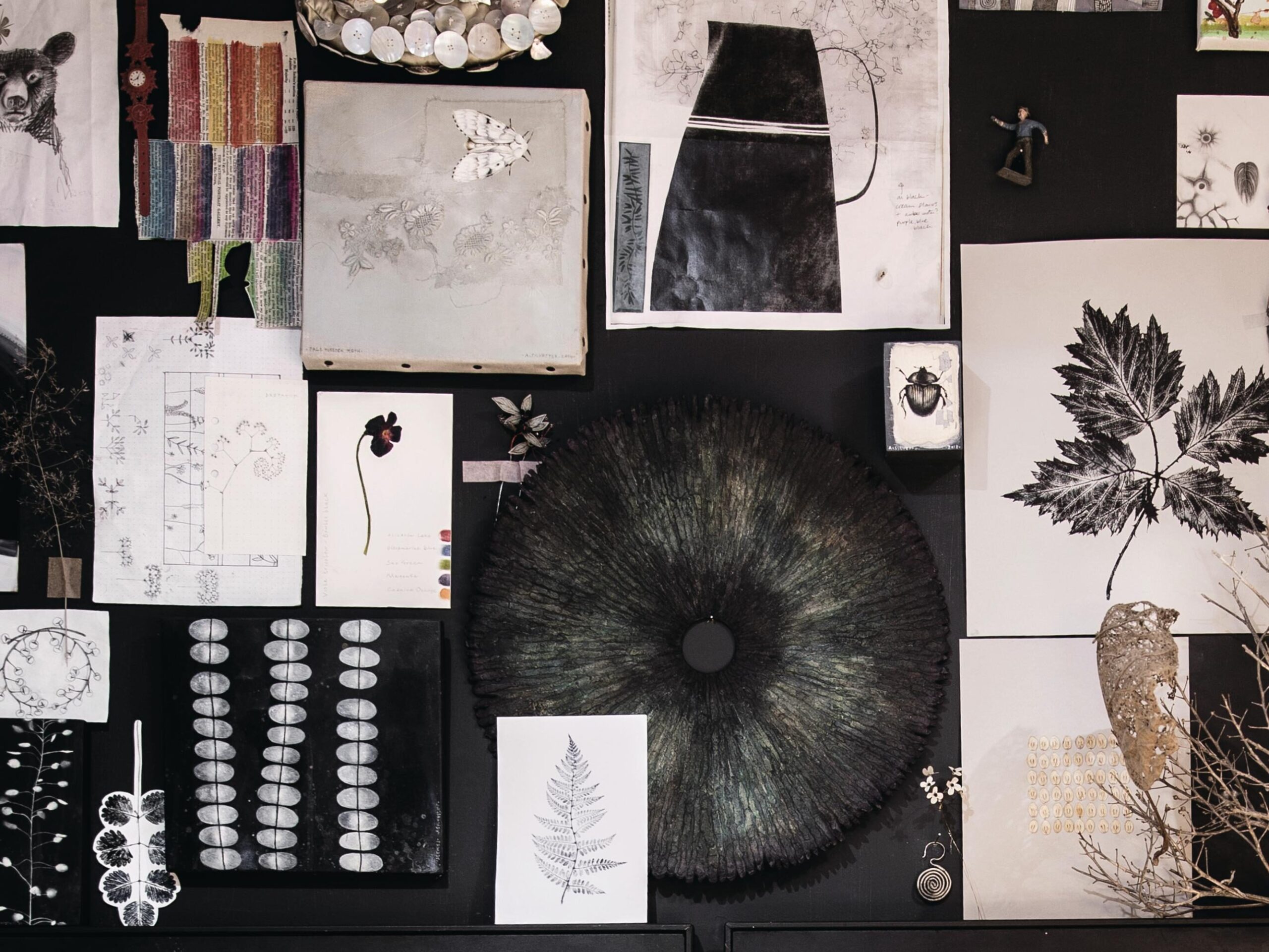 Examples of Allison Sylvester's artwork on her studio wall