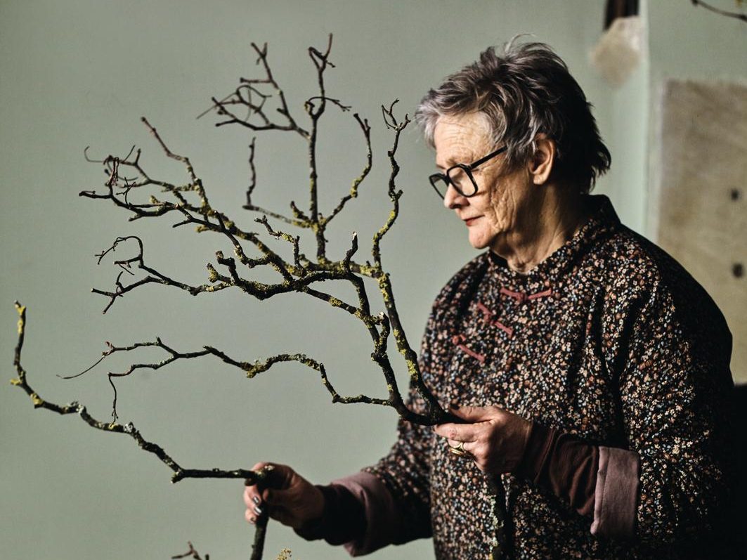 Woman making decorations with branches
