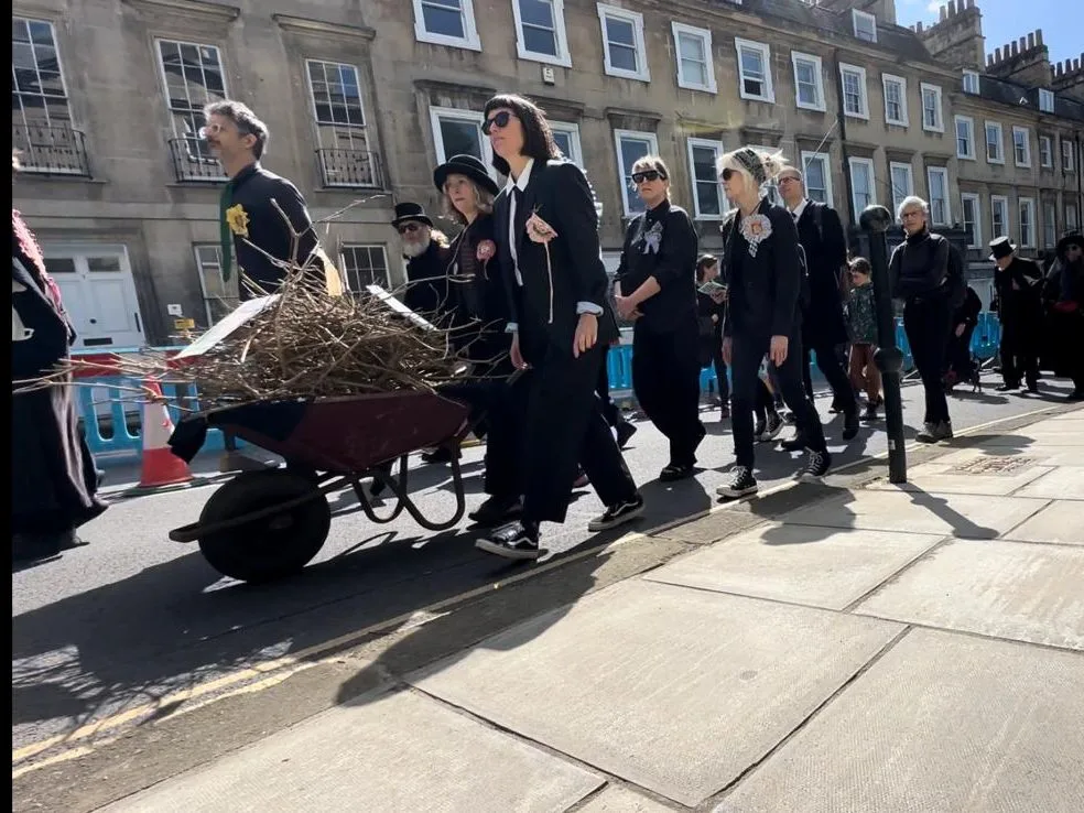 Hedge funeral 3 credit Rachel Meyrick People walking through the streets