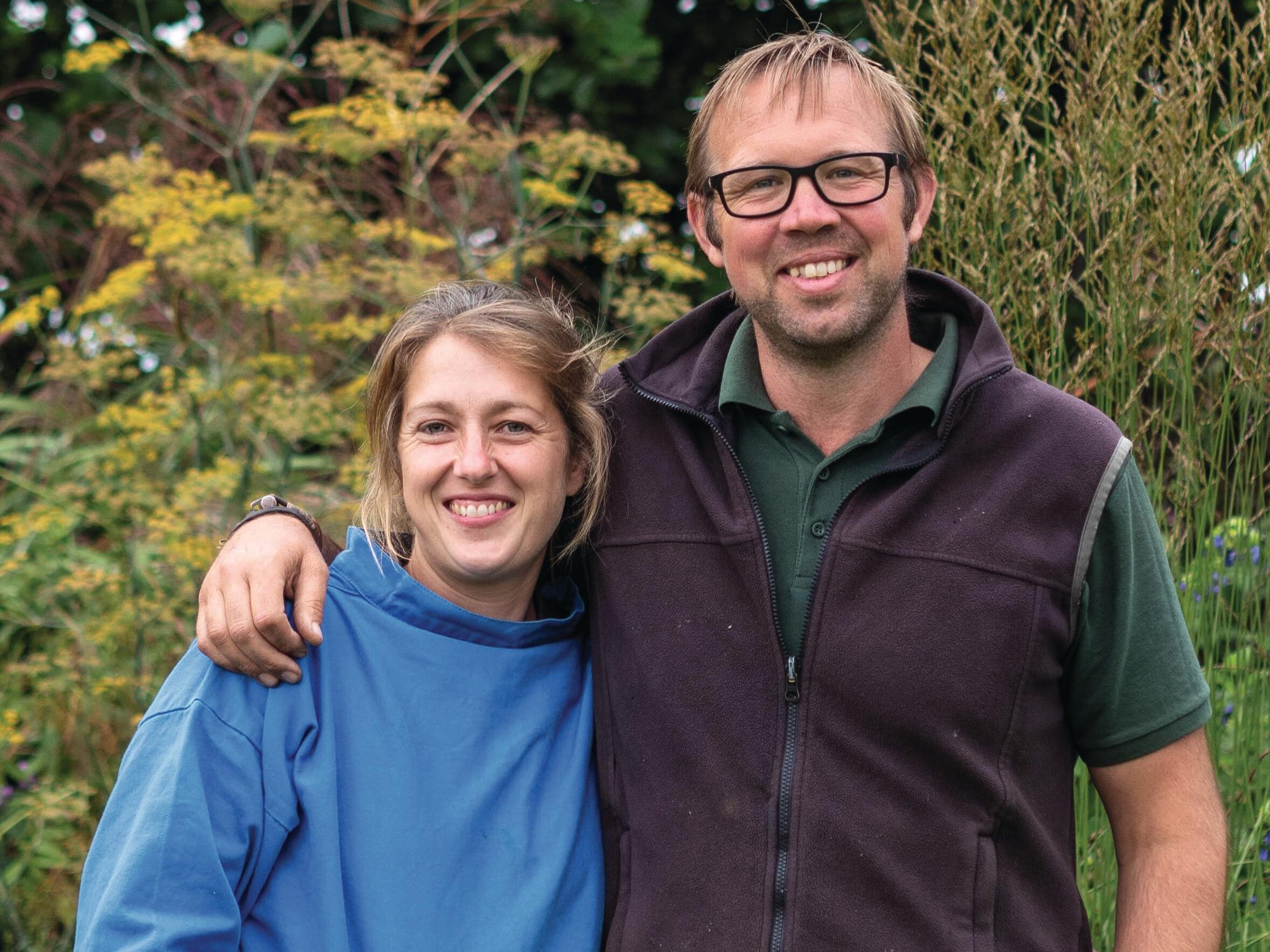 Man and woman stood in garden