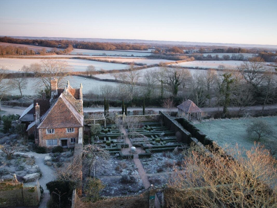 Winter garden and house surrounded by countryside