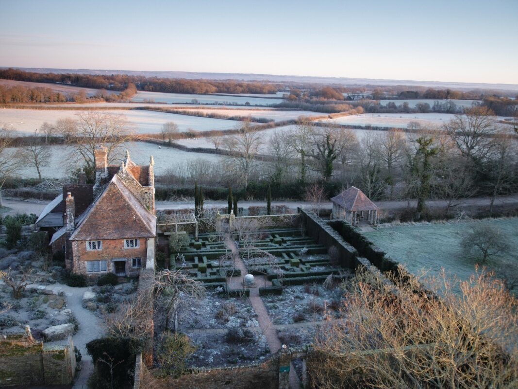 Winter garden and house surrounded by countryside