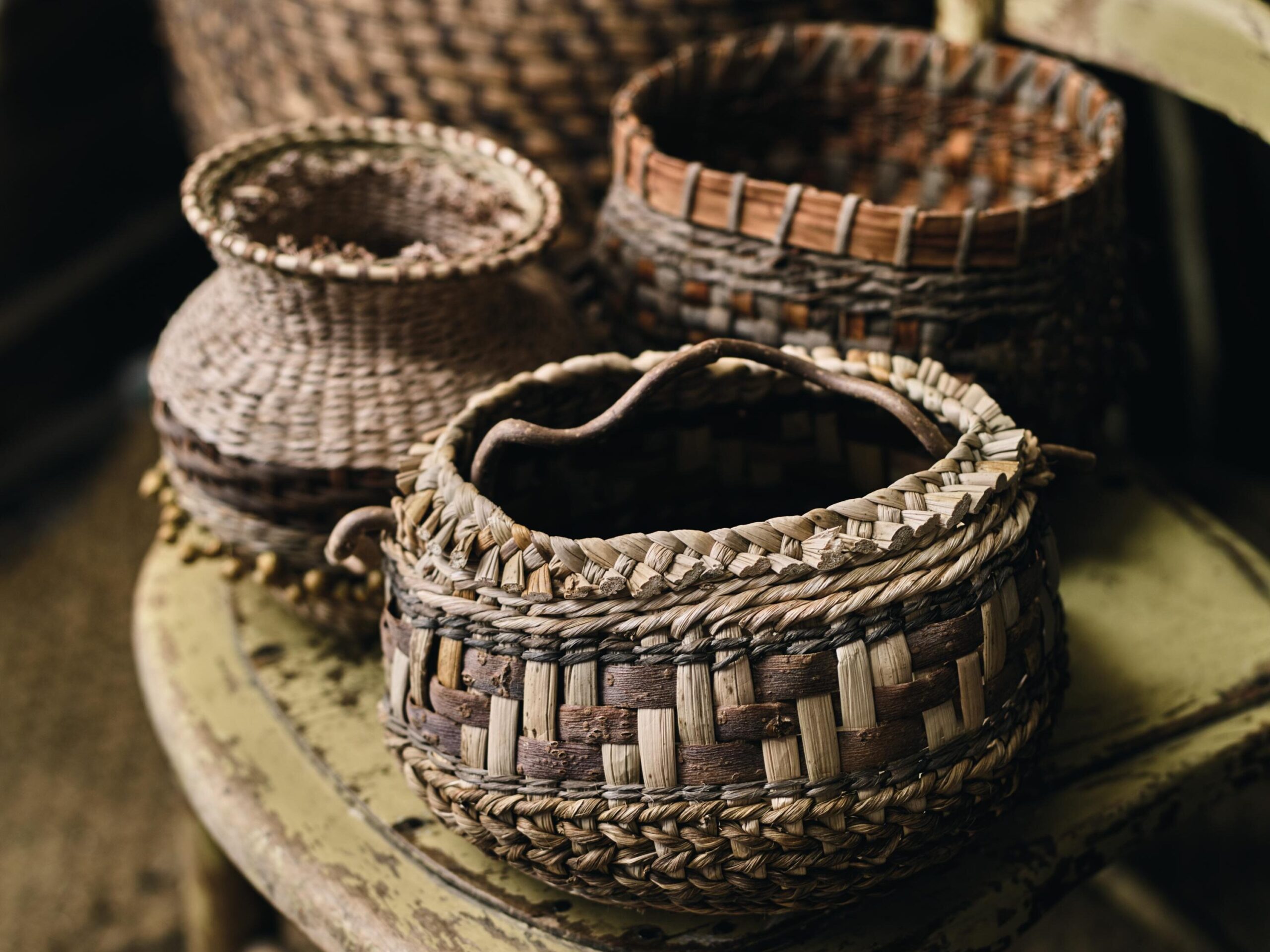 A selection of baskets Mollie has made as one-off exhibition pieces. For these she uses many different fibres, including willow bark, banana leaf, crocosmia leaves, lime bark, daffodil leaves, English rush and grasses.