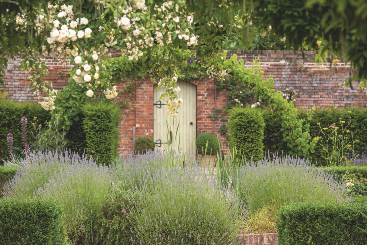 A walled garden with a gate