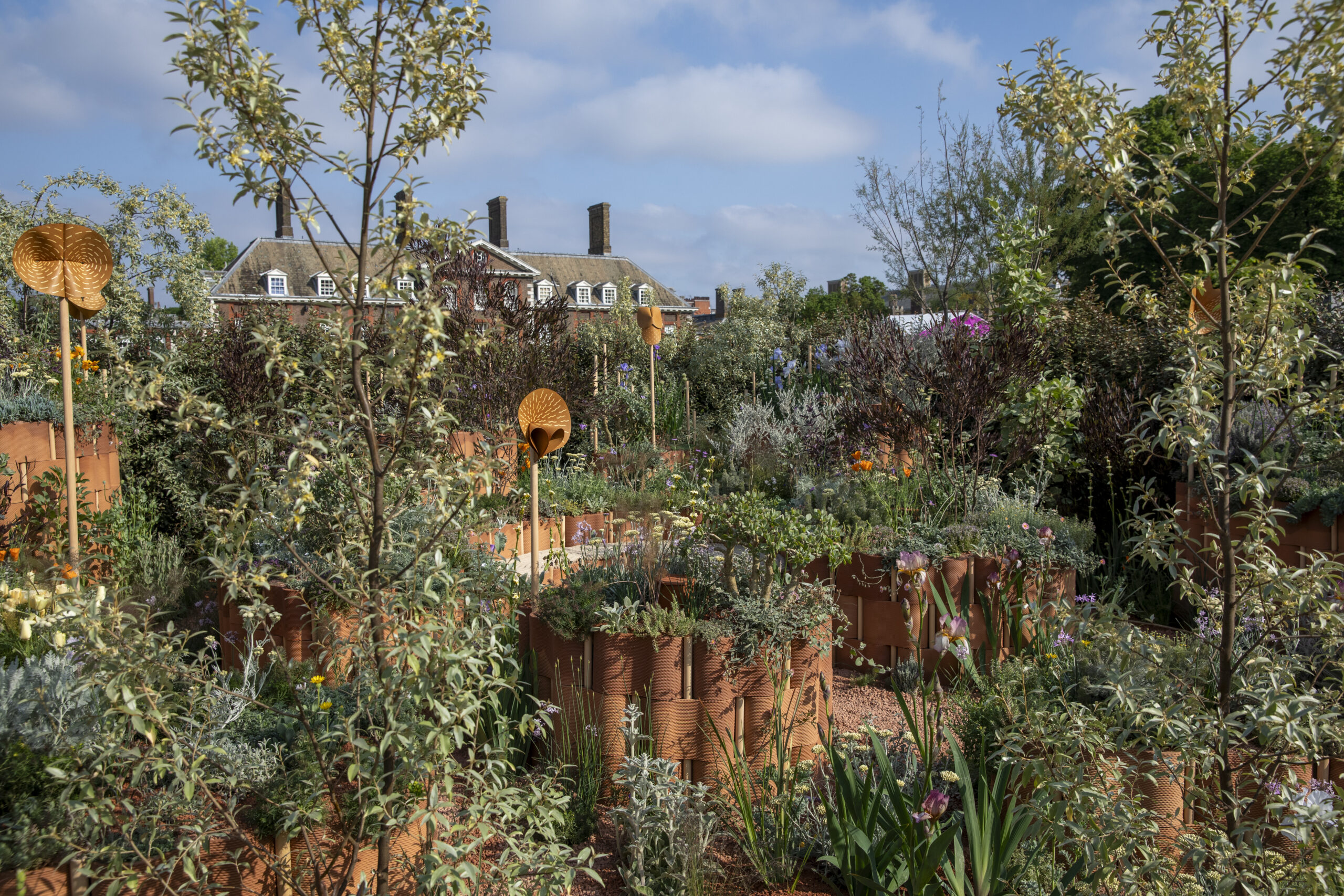 World Child Cancers Nurturing Garden at the RHS Chelsea Flower Show 2024. Designed by Giulio Giorgi. Sponsored by Project Giving Back