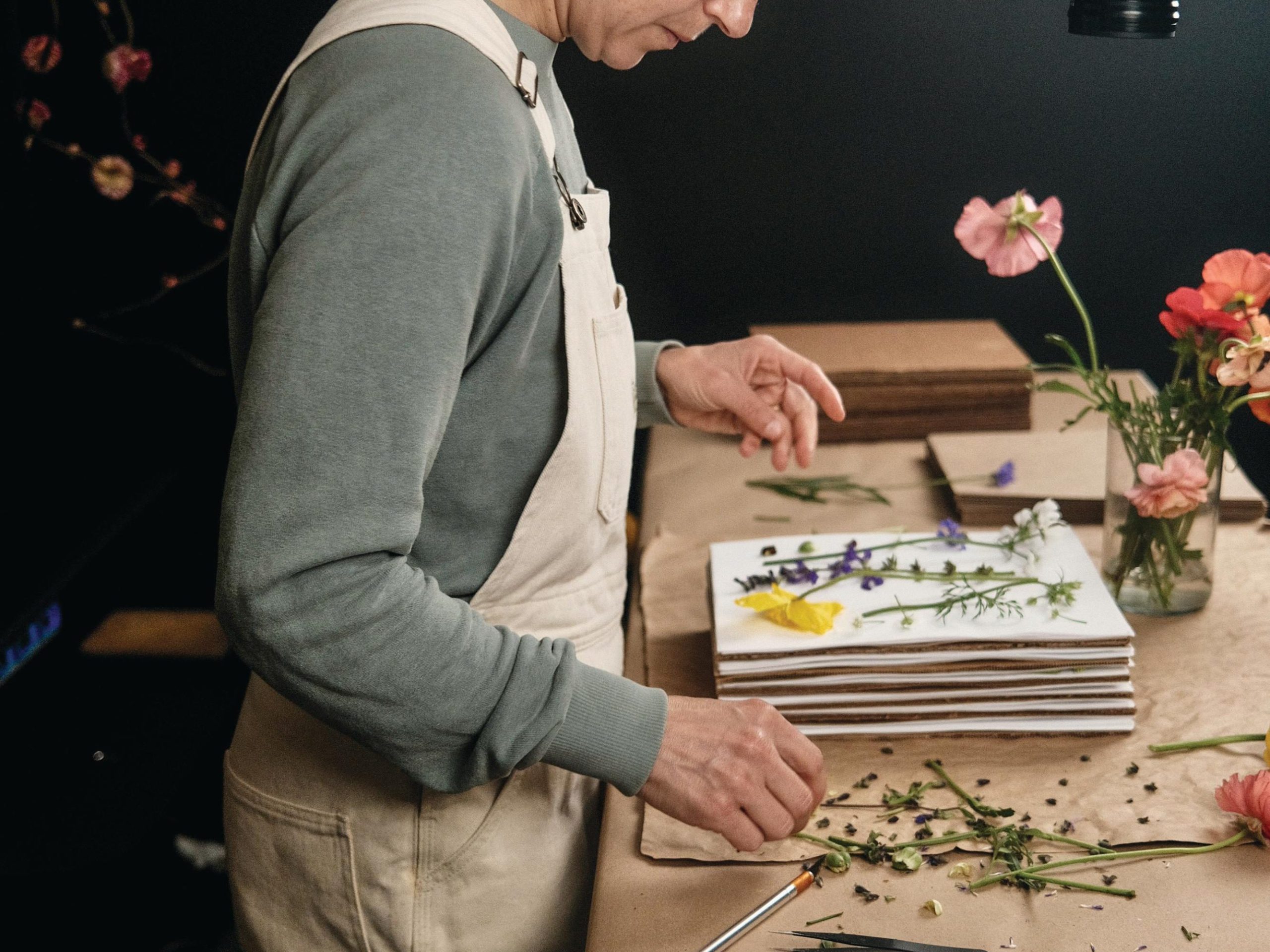 Woman pressing flowers
