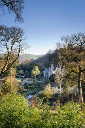 Gresgarth Hall sits at the mouth of a wooded valley, with the brook Artle Beck drawing a sweeping curve as it rushes past the house. Dark yew hedges stamp formality near the house and echo the stone walls etched on the hills beyond. Gresgarth Hall sits at the mouth of a wooded valley, with the brook Artle Beck drawing a sweeping curve as it rushes past the house. Dark yew hedges stamp formality near the house and echo the stone walls etched on the hills beyond.