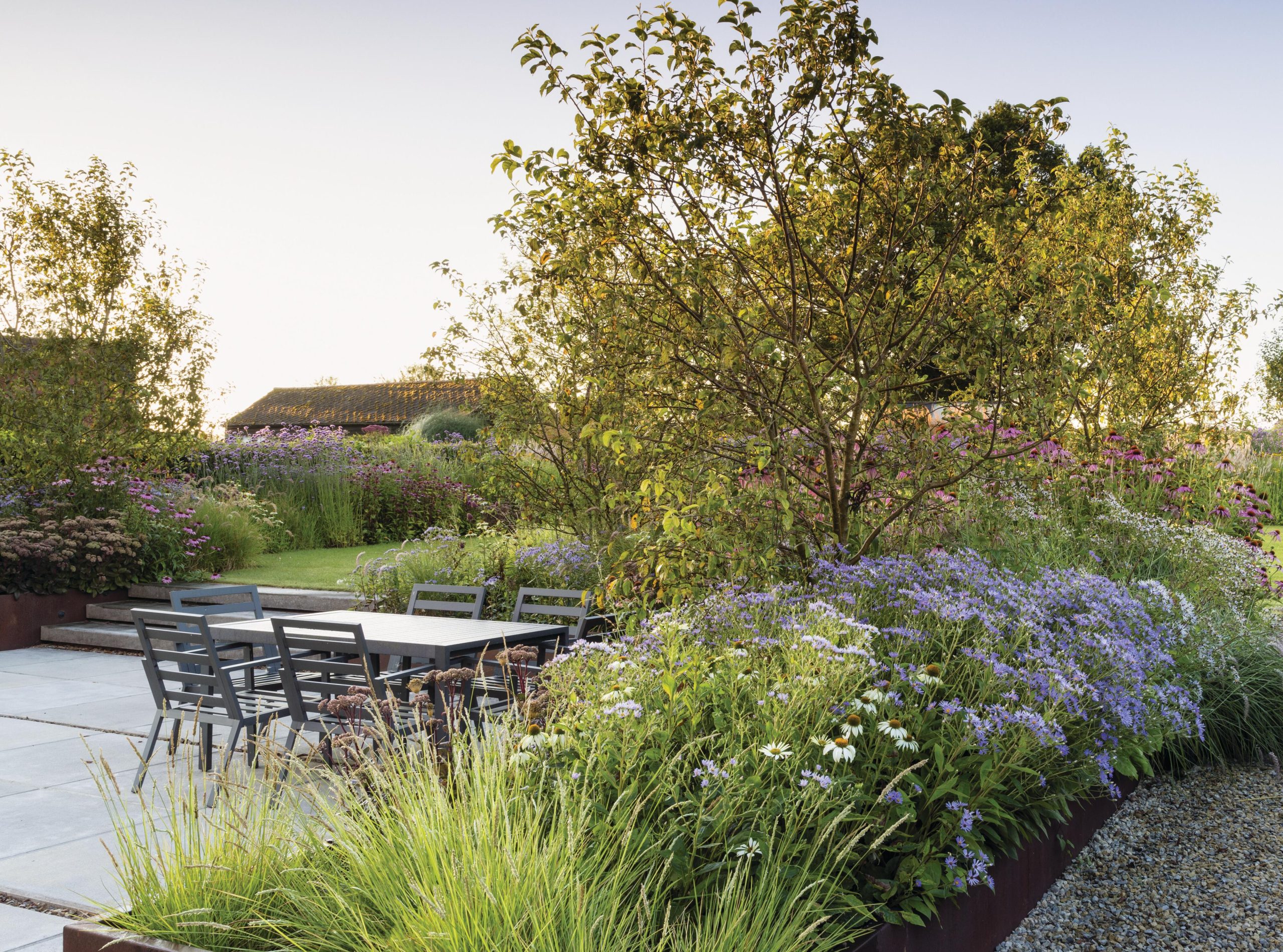 A garden with table and chairs
