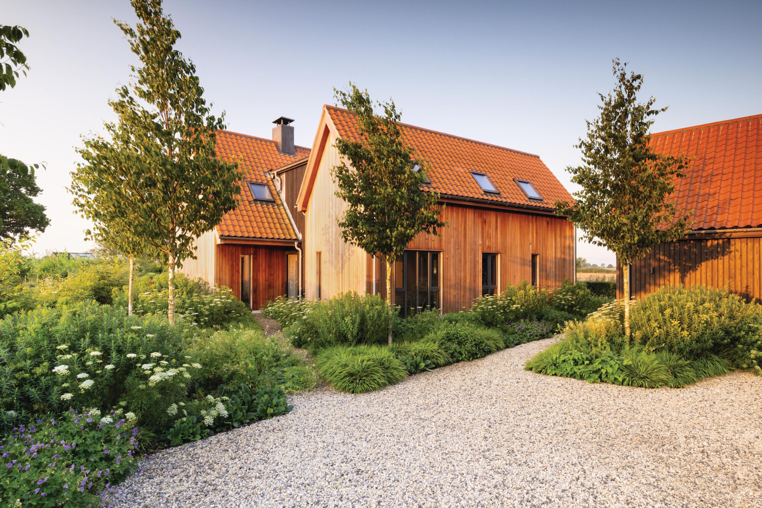 Three houses in a garden