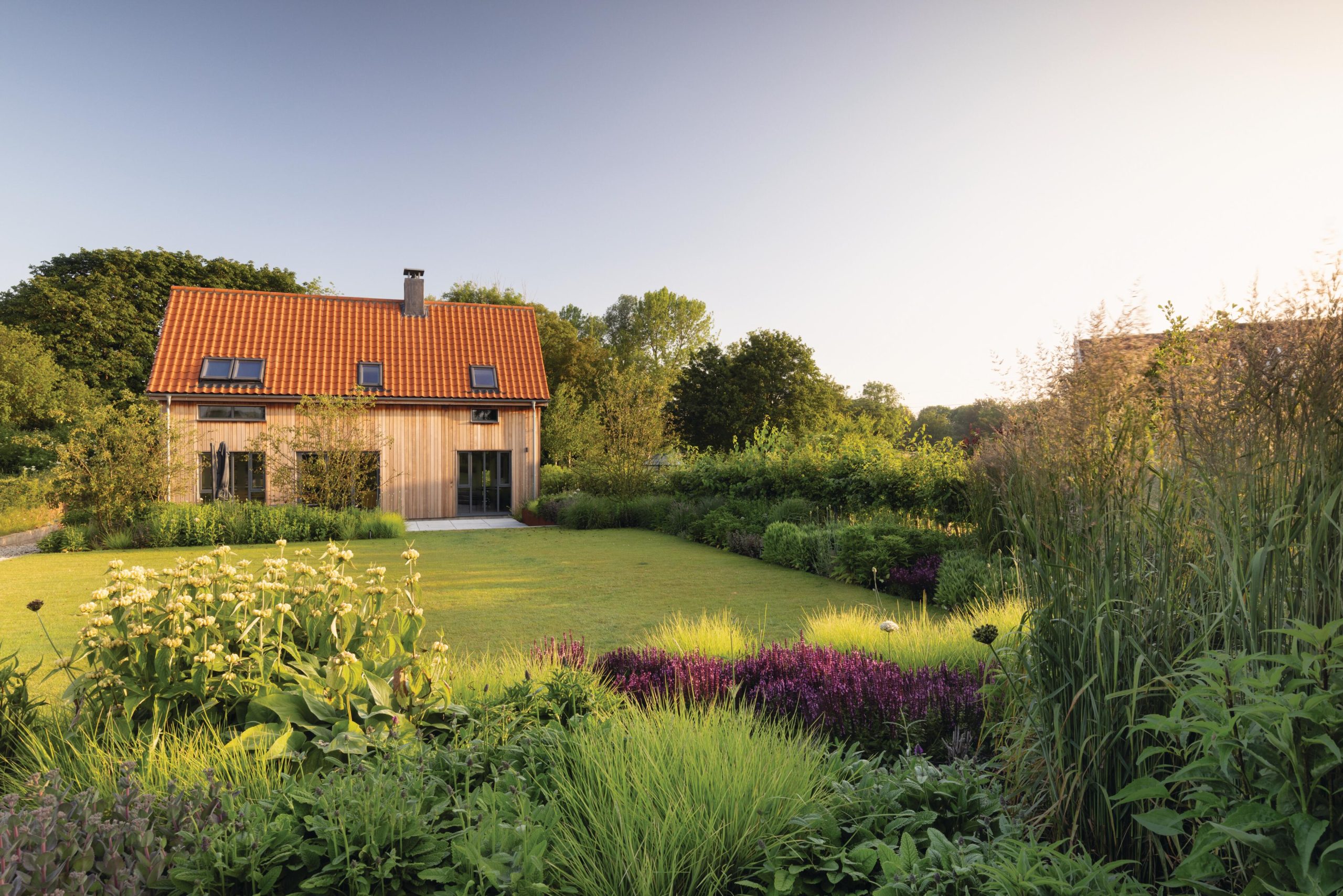 A house with a lawn and garden