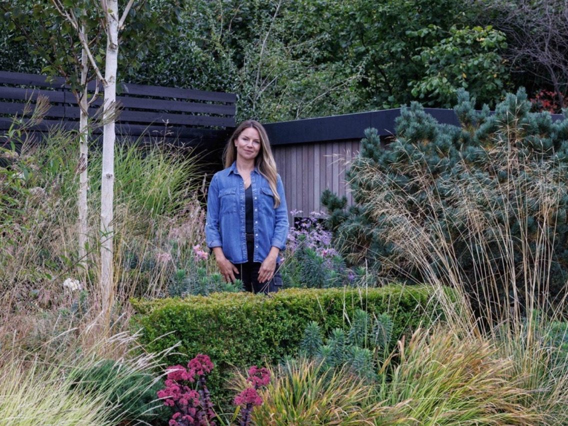 Woman stood in garden